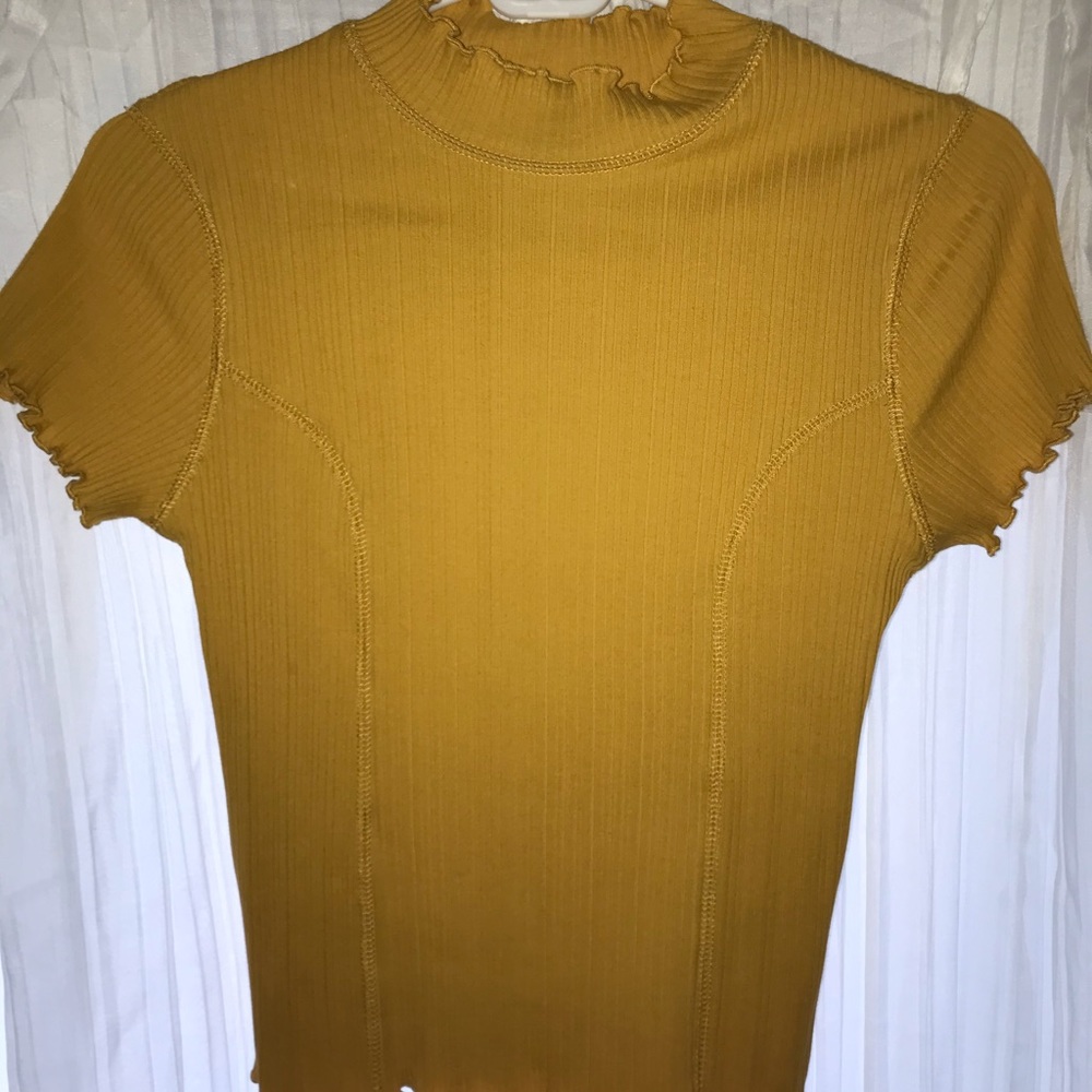 Yellow top with ruffled neck and sleeves